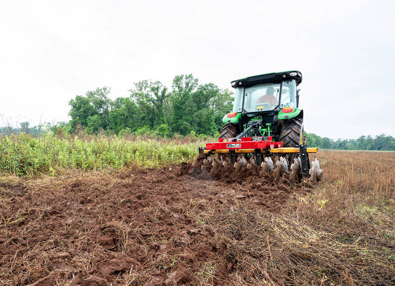Farm machine working on field